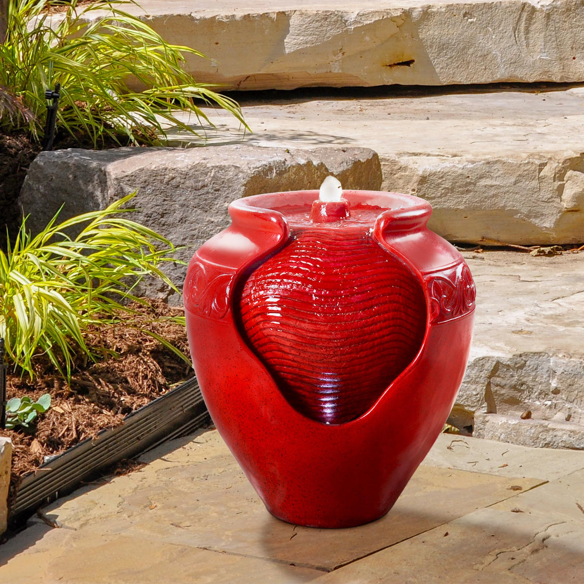 Teamson Home fountain showcases wave texture on sides for decorative appeal.