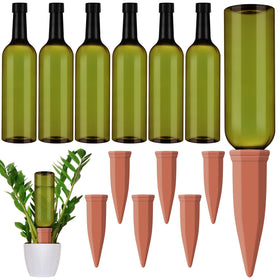 Teenyyou terracotta self-watering spikes inserted into soil to regulate moisture for indoor plants.