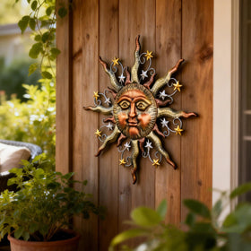 TERESA'S COLLECTIONS 3D sun metal art stands out as a durable garden focal point.