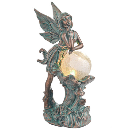 Teresa's Collections fairy garden statue with crackle-glass globe provides enchanting glow for outdoor spaces.