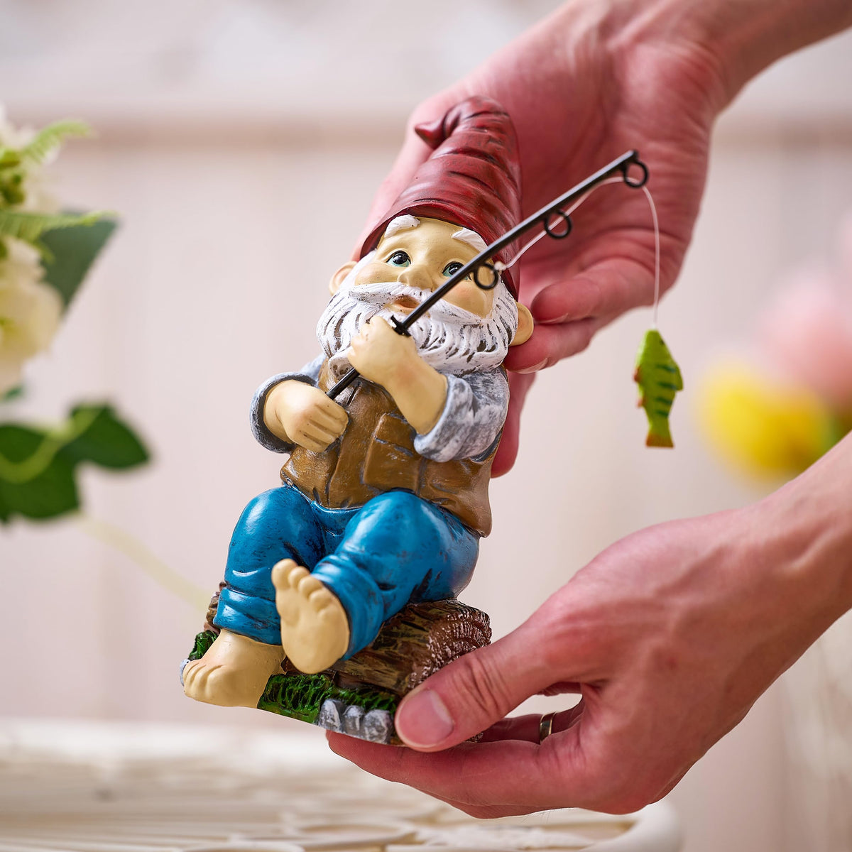 TERESA'S COLLECTIONS resin gnome makes a charming gift for garden lovers.