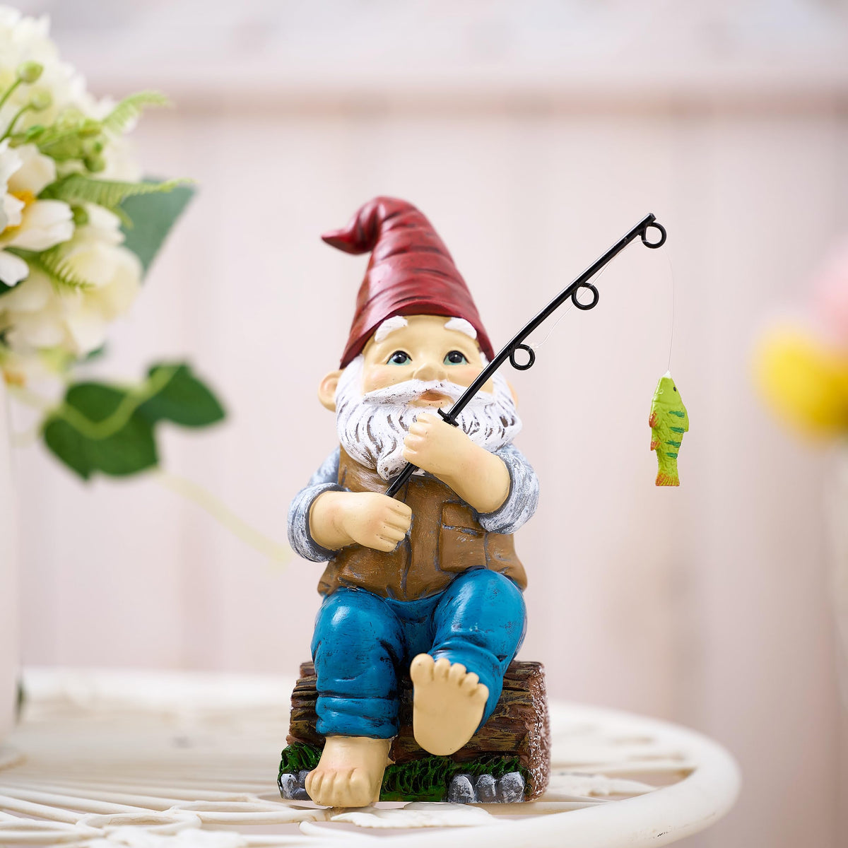 TERESA'S COLLECTIONS resin gnome with waterproof finish stays vibrant in sun and rain.