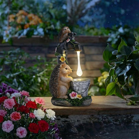 TERESA'S COLLECTIONS hedgehog faucet display adds whimsical charm to porches.