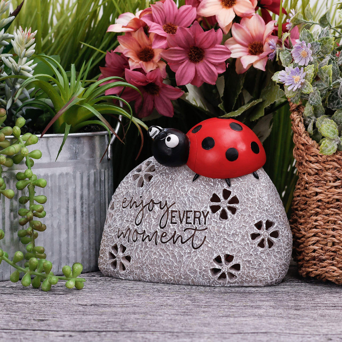 Teresa's Collections outdoor garden ornament featuring a smiling ladybug on a rock