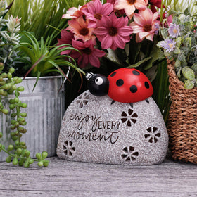 Teresa's Collections outdoor garden ornament featuring a smiling ladybug on a rock
