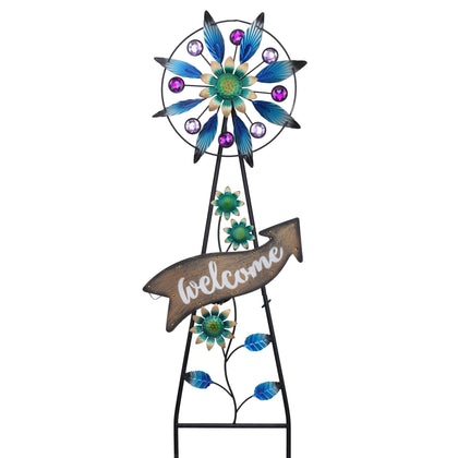Teresa's Collections Peacock Garden Solar Stake with blue wind spinner for outdoor evenings.