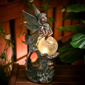 Teresa's Collections solar-powered garden fairy statue lights up automatically after daylight.