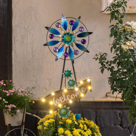 Teresa's Collections rustic wooden welcome sign adds curb appeal.