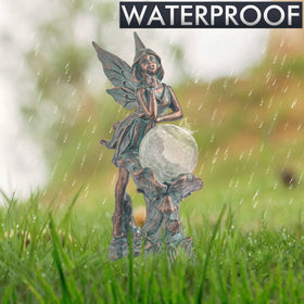 Teresa's Collections lawn fairy statue highlights pathways with a soft, decorative glow.