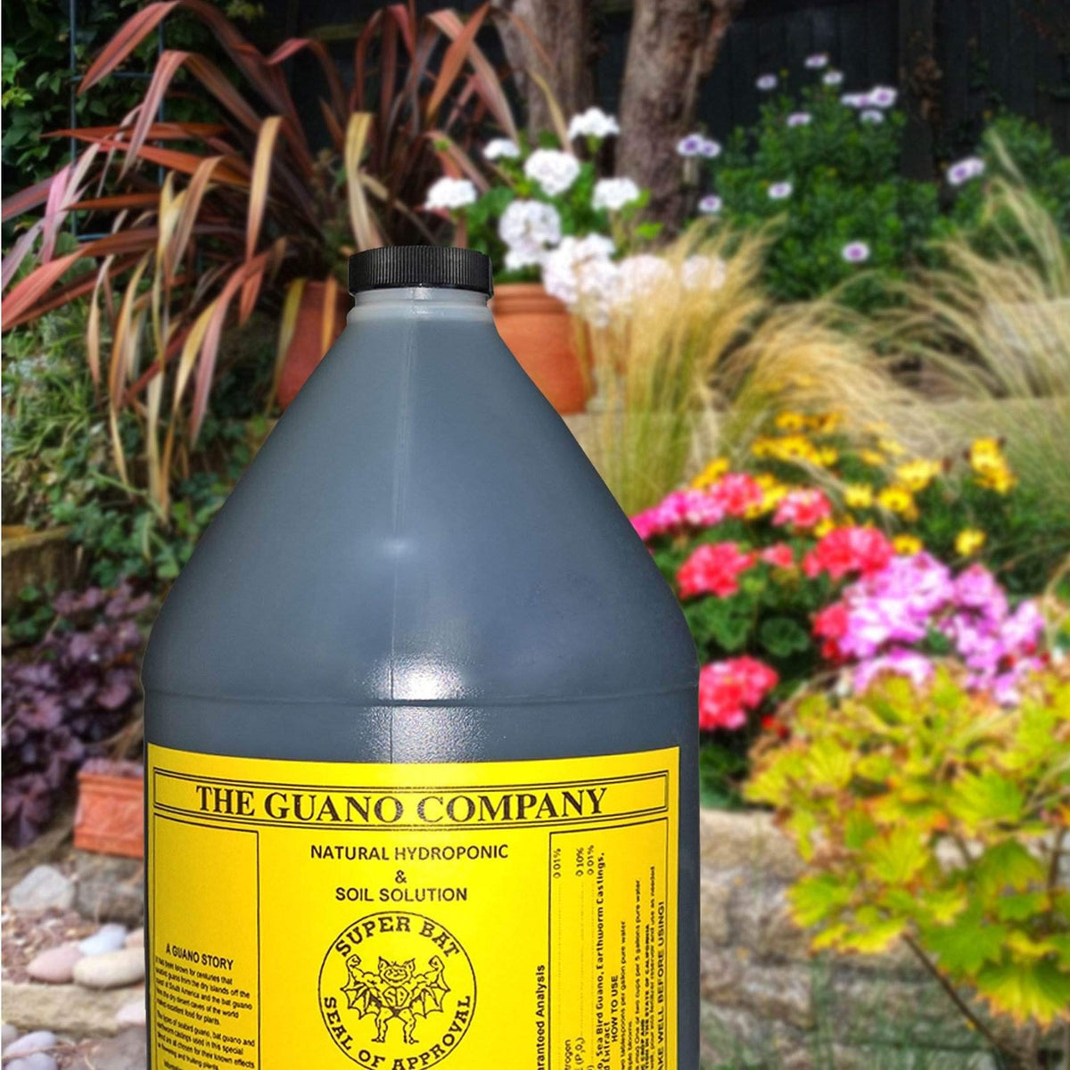 Bottle label shows organic ingredients and usage directions for flowering plants