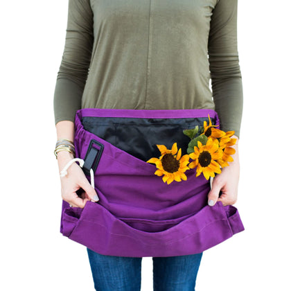 The Roo gardening waist apron with pockets keeps tools handy during planting and weeding.