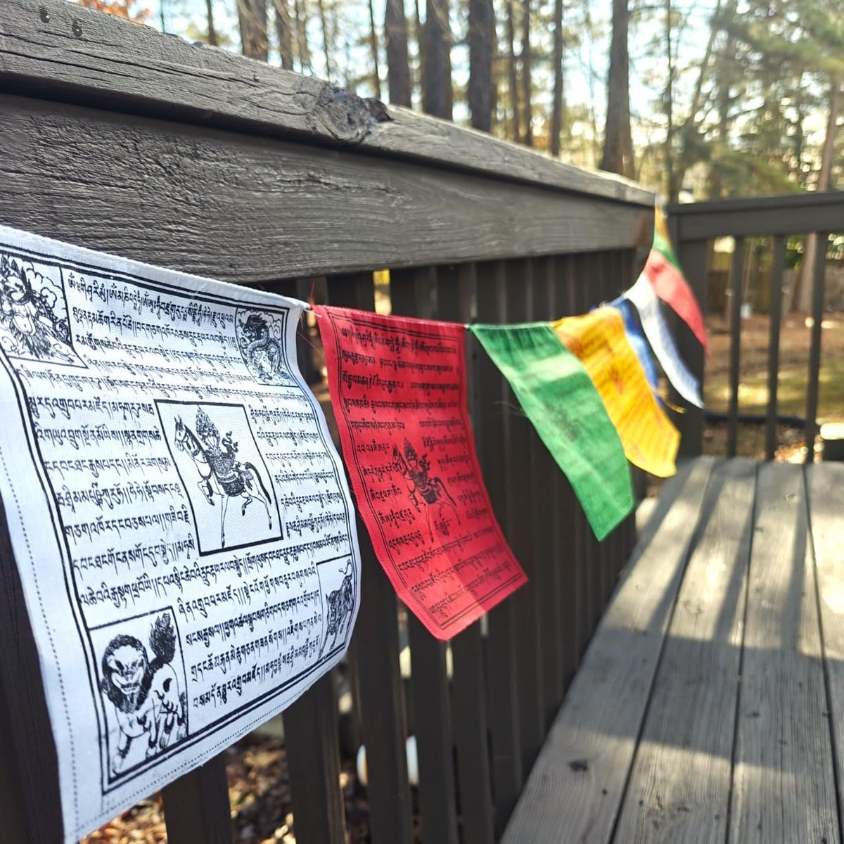 Monk-blessed flags from Nepal by The Swayambhu adding authentic spiritual energy.