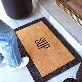 Theodore Magnus door mat coir texture closeup shows natural fibers and durability.