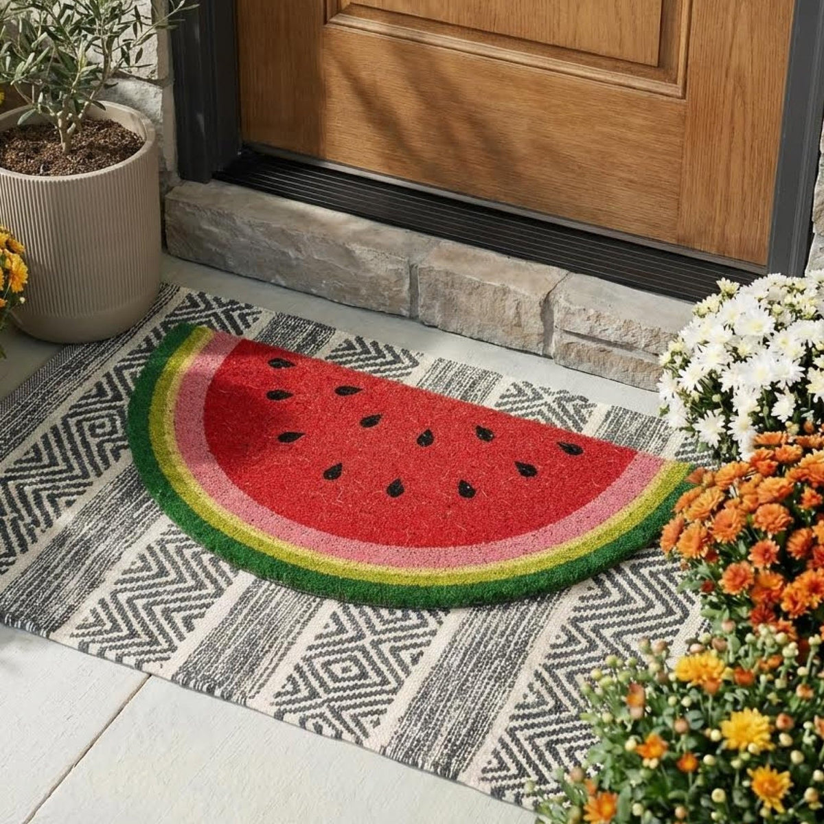 Theodore Magnus door mat with non-slip backing provides stable entrance placement.