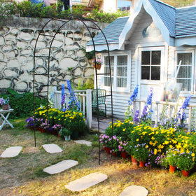 THORISE green pergola arch highlighting climbing plants for a natural garden entrance