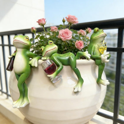 Thryonaxus Sherum Trio hugging wine bottles for playful shelf display.
