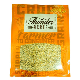 Thunder Acres Barley Seed sits ready in a garden bed for seasonal sowing.