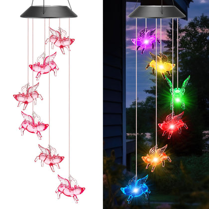 Thyle Flying Pigs wind chimes illuminate outdoor patio with whimsical glow