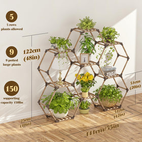 Tikea hexagonal plant stand outdoors on a patio with greenery