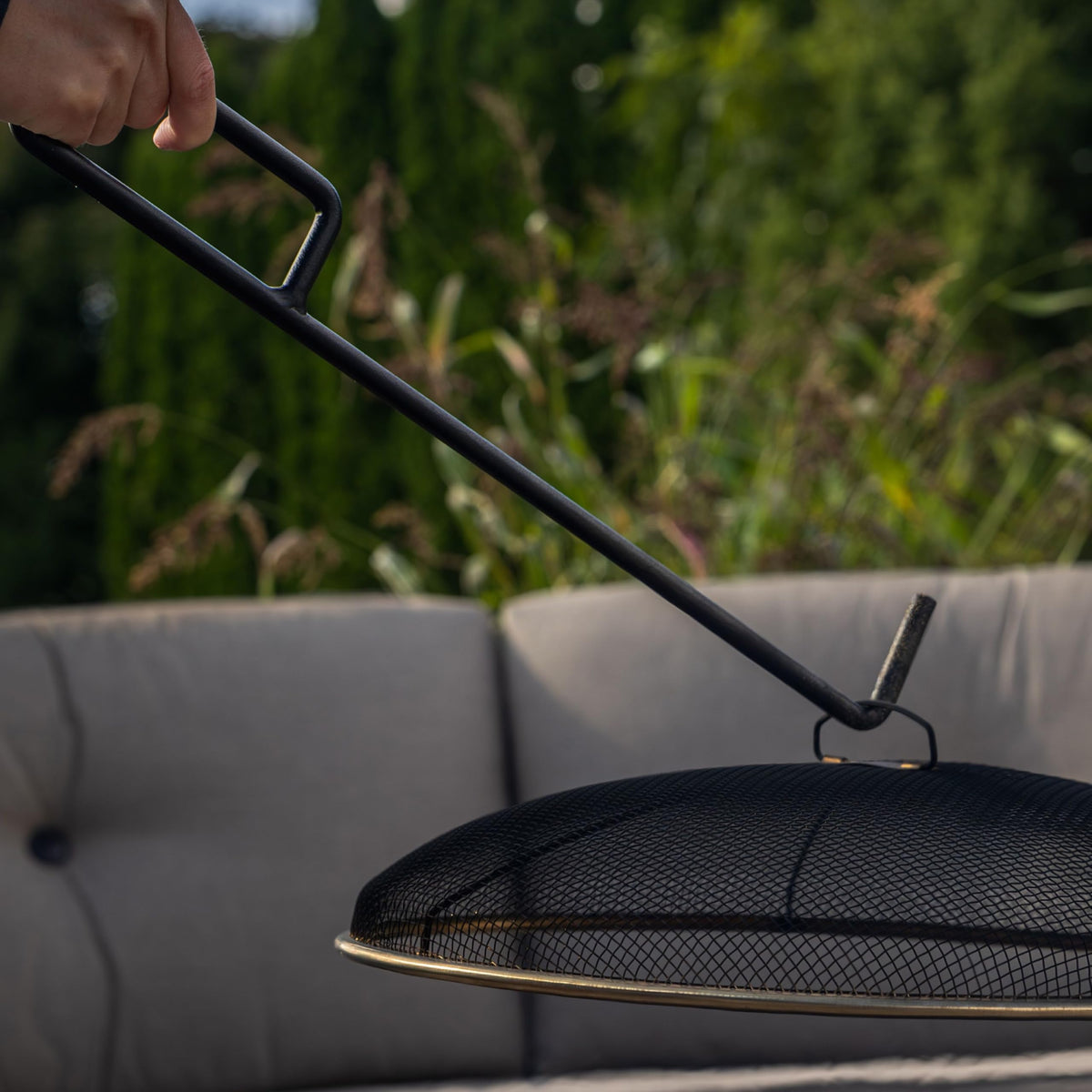 TIKI screen hook design enables lifting and resting the lid without removing the screen.