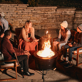 TIKI Smokeless Reunion Fire Pit assembly shows quick two-piece setup for patio use.