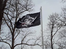 Time Roaming pirate flag brass grommets close-up showing durable hardware