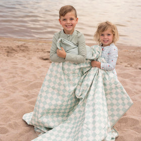 Tiny Twinkle blanket folded into its compact pouch for easy trunk storage