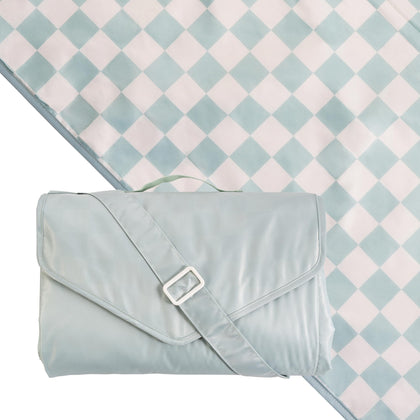 Tiny Twinkle waterproof picnic blanket laid flat on sand for a beach day