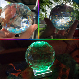 Tirifer rainbow refractions streaming through suncatcher on window