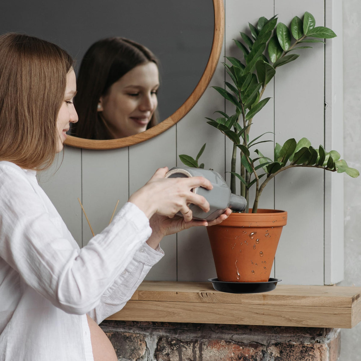 TNTIWQ plant saucer on a patio scene suitable for various pots.