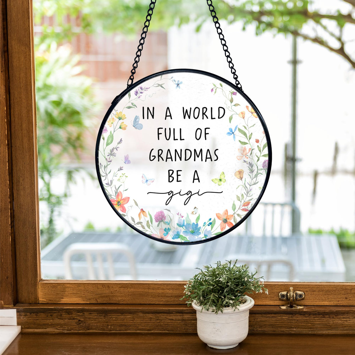 TNUW Gigi Gifts round art decor closeup of textured glass and metal frame