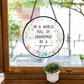 TNUW Gigi Gifts round art decor closeup of textured glass and metal frame