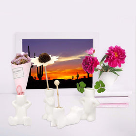 Together-life wedding and office decor air head planters add whimsy.