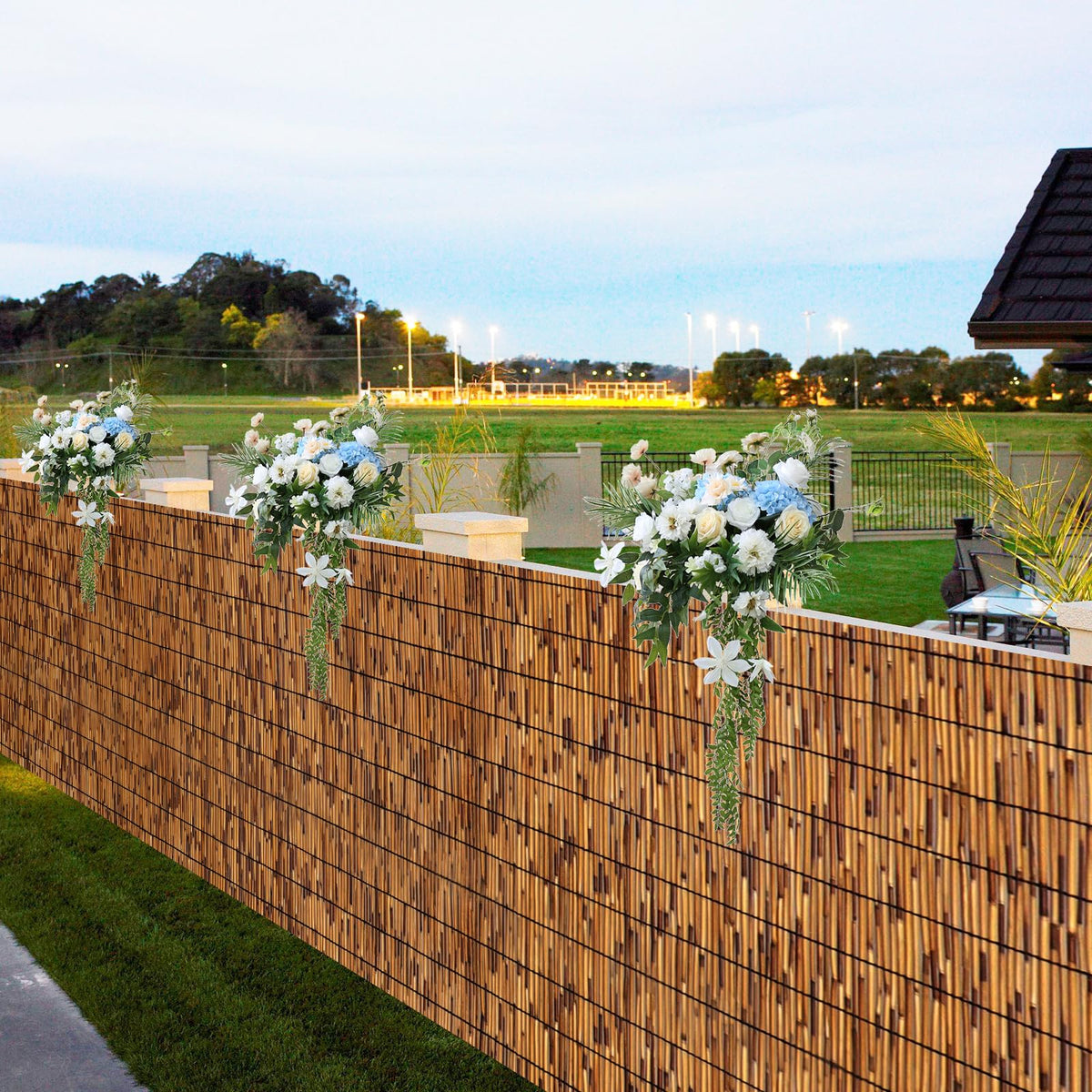 TOOKNIN natural reed fence front view highlights privacy potential with breathable bamboo texture.