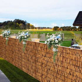 TOOKNIN natural reed fence front view highlights privacy potential with breathable bamboo texture.