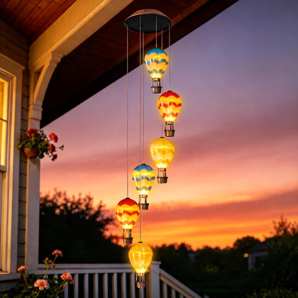 Topstor hot air balloon wind chime enhances garden decor with colorful balloons and soft glow.