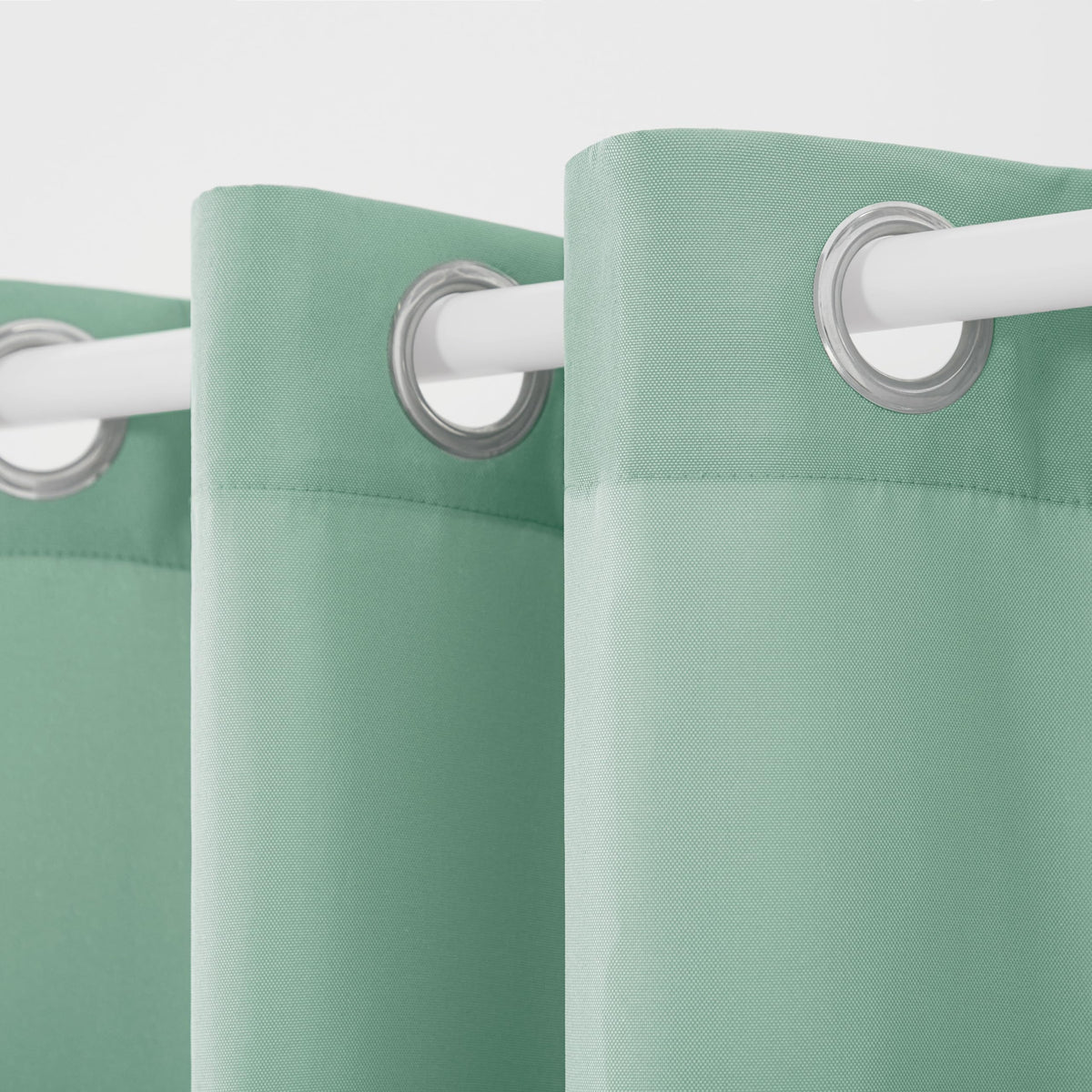 Grommet-top detail on Cabana curtains shows rust-proof hardware for easy hanging