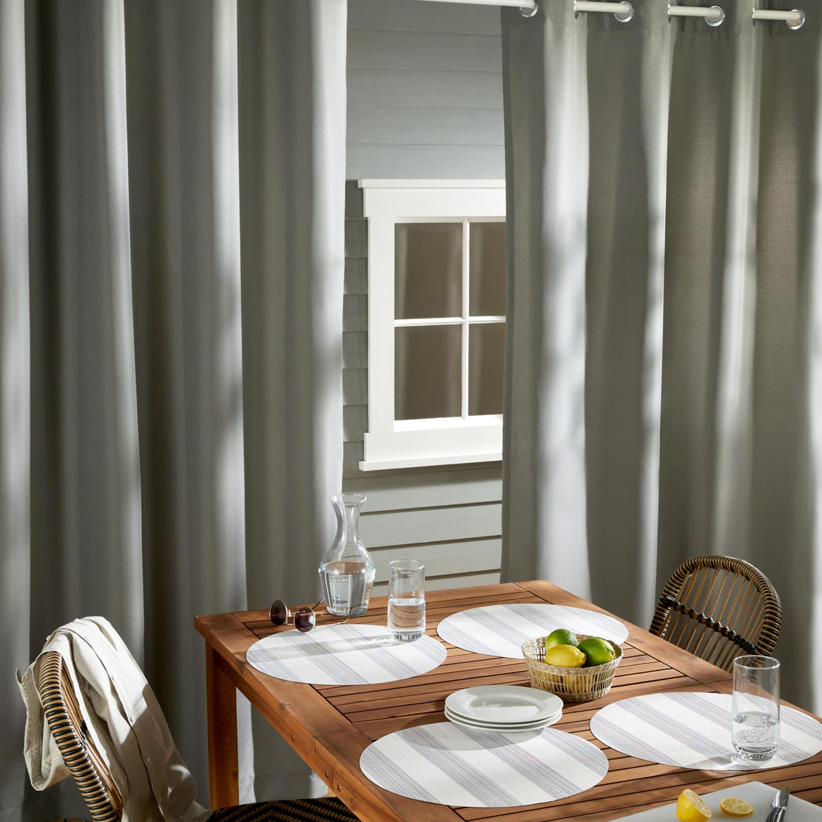 Town & Country Basics Cabana curtains with water-repellent finish for outdoor spaces.