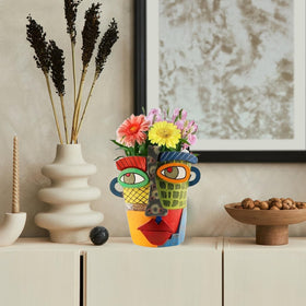 TOZLU Picasso head planter on shelf, contemporary charm