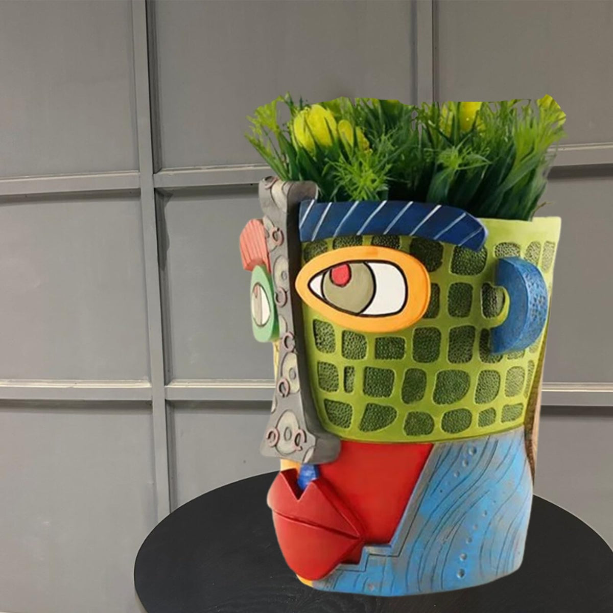 TOZLU Picasso head planter, side angle, textured resin finish