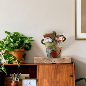 TOZLU wall-hanging face planter saves space with artistic charm.
