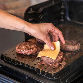 Traeger ModiFIRE sear grate in-use showing ridges capture moisture and flavor.