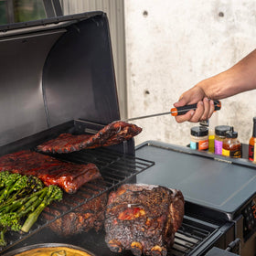 Traeger Pig Tail Flipper’s 12-inch length keeps hands away from heat.