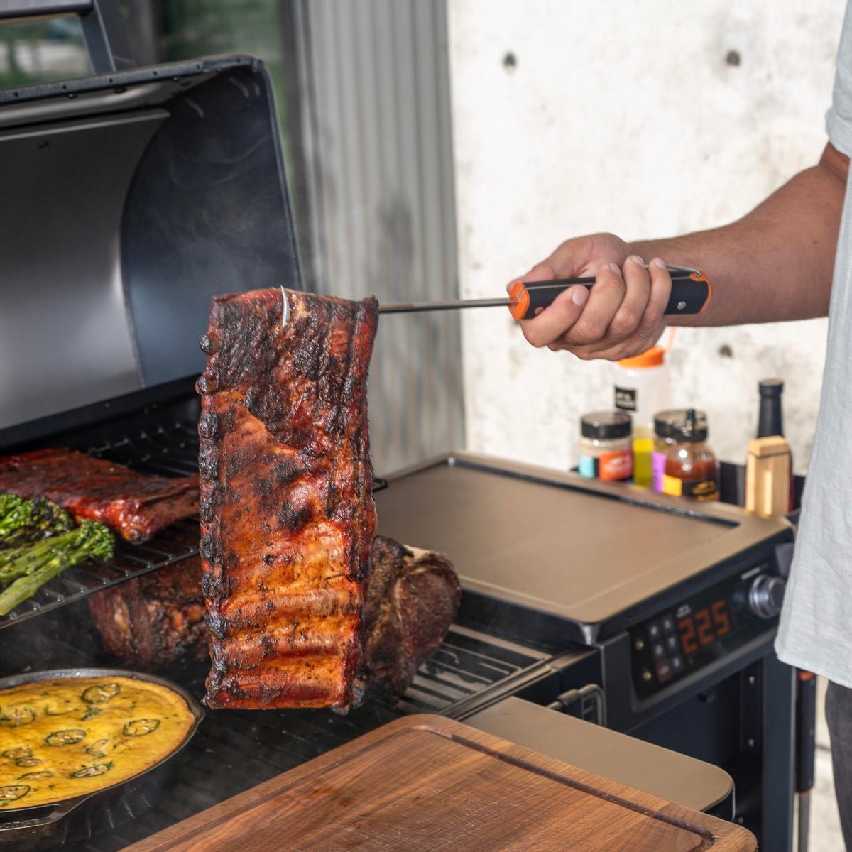 Traeger Pig Tail Flipper shows sturdy handle and loop for safe grilling.