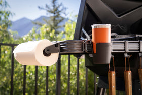 Cup holder mounted on P.A.L. rail freeing counter space during cookouts