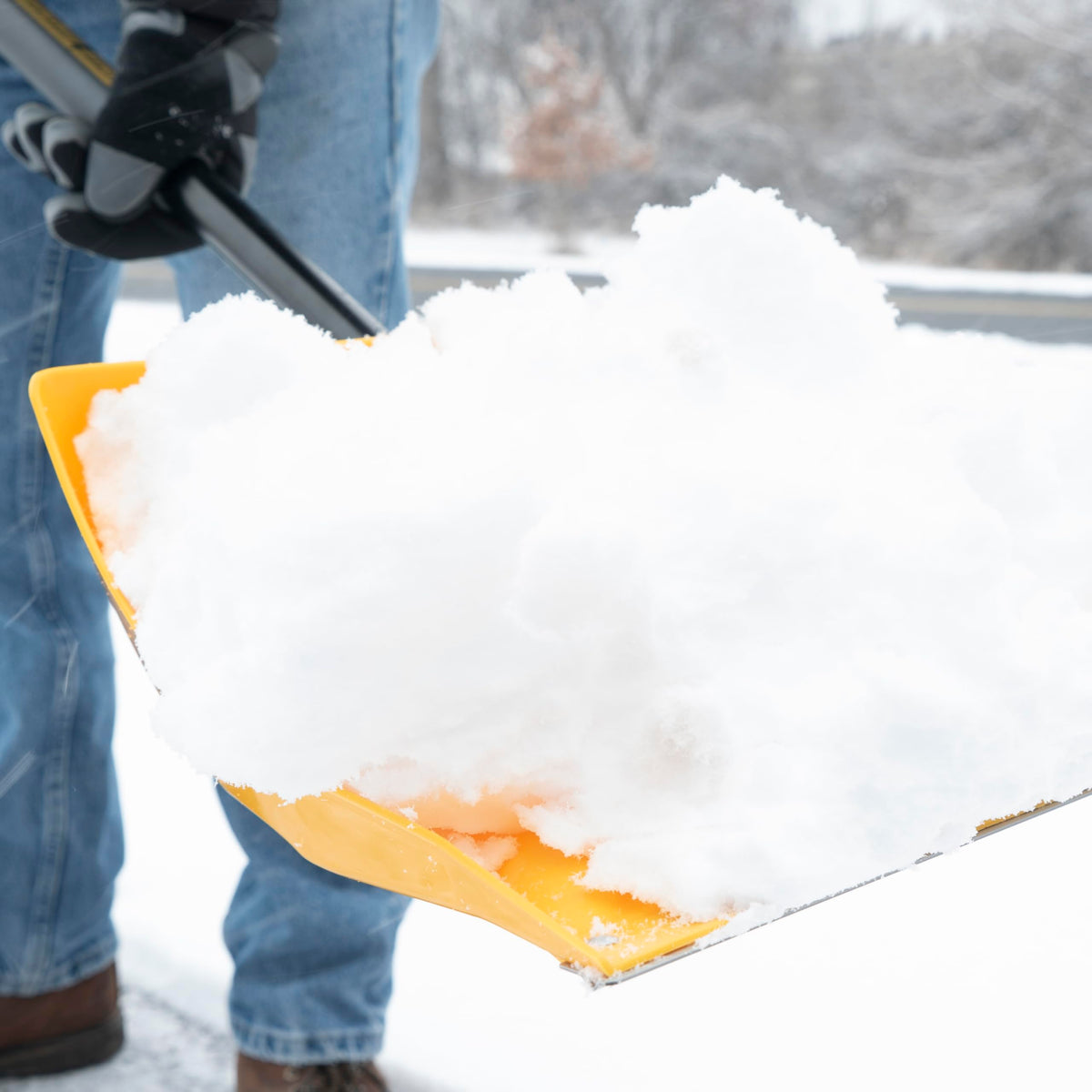 TRUE TEMPER car and camping snow shovel in use for portable snow removal.
