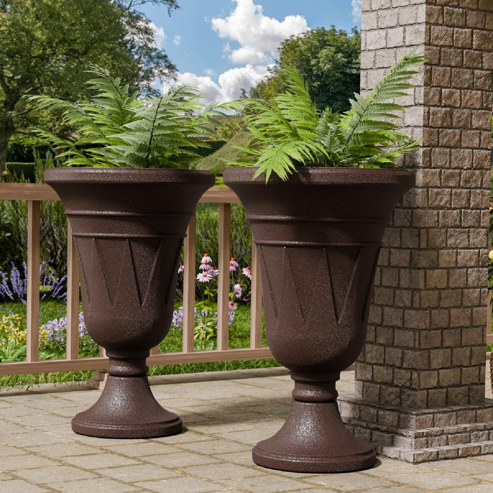 Trygoal tall urn planter on porch with lush blooms for outdoor appeal.