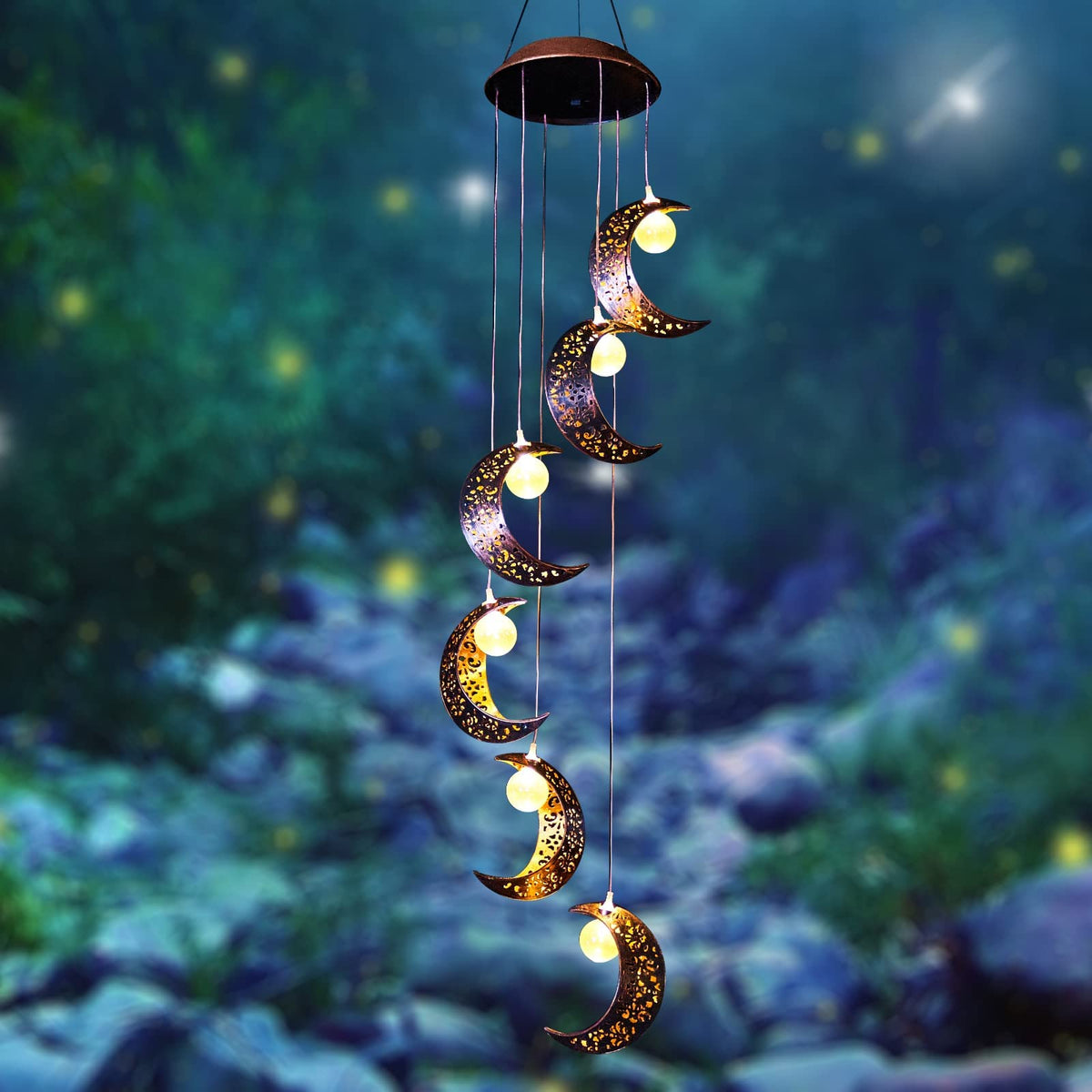 Tryme solar moon windchimes illuminate the patio with a cozy glow