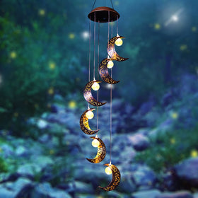 Tryme solar moon windchimes illuminate the patio with a cozy glow