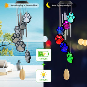 TSIPEKLO color-changing LED paw print wind chime enhances yard ambiance after sunset.